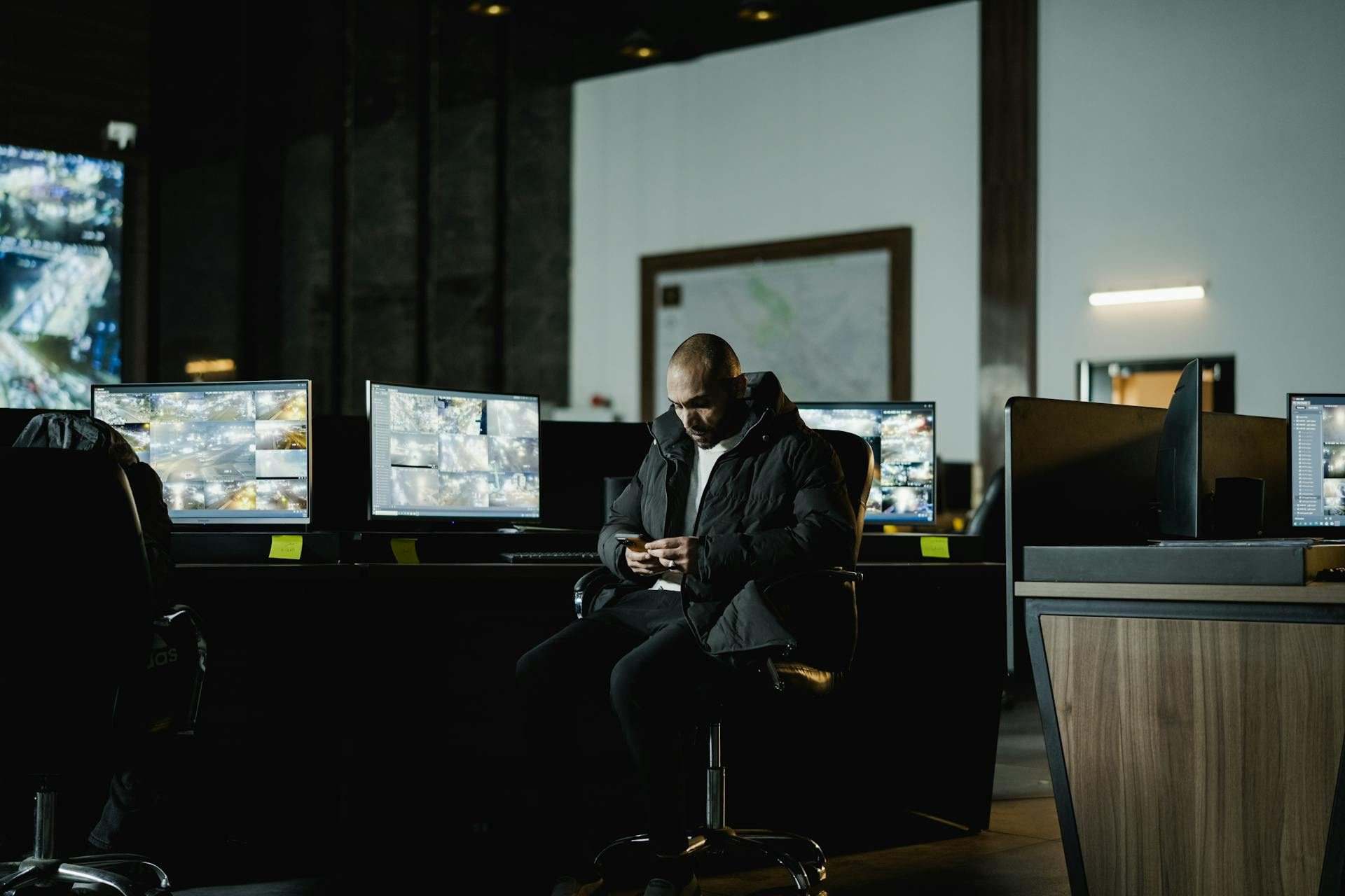 Security operations center with live camera feeds on multiple monitors