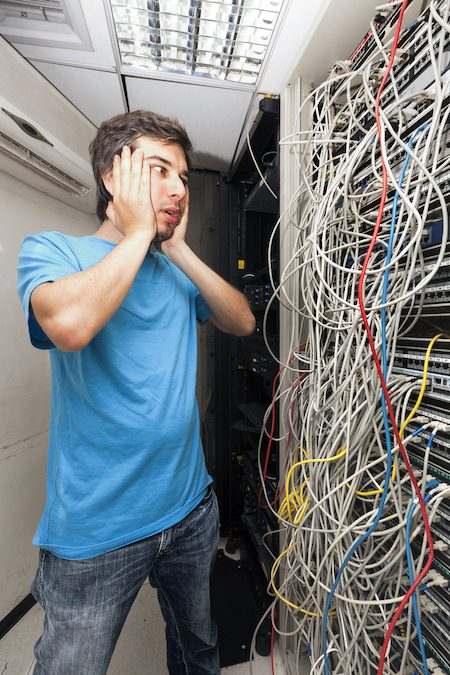 Before - messy, disorganized network closet
